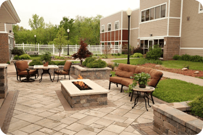 Outdoor seating area with firepit at a nursing home