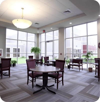 Bright lounge area with large windows and seating