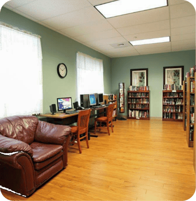 Interior view of a common area with computers and bookshelves