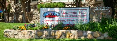 Signage for Mountain Villa nursing facility with flowers