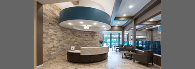 Interior lobby of a senior living facility with seating area