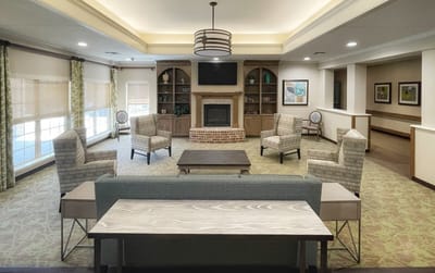 Bright common area with comfortable seating and fireplace