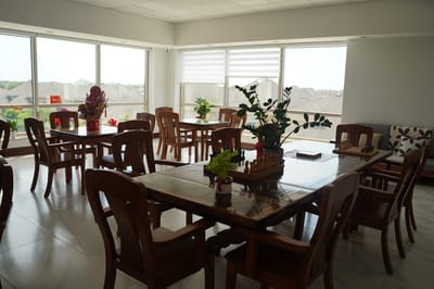 Bright common area with tables and chairs