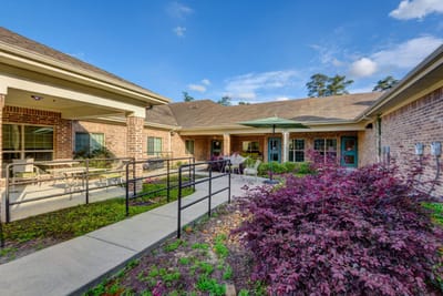 Outdoor patio area with seating and landscaping