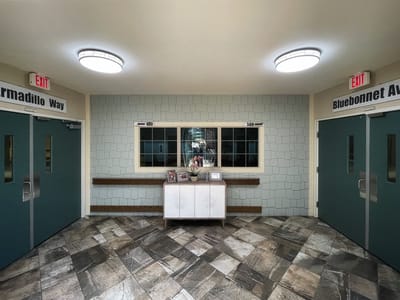 Interior hallway with directional signs and decor