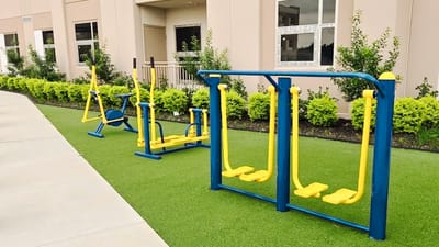 Outdoor fitness equipment in a well-maintained area