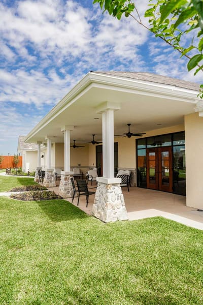 Outdoor view of the assisted living facility with seating area