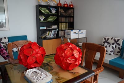 Decorative paper lanterns on a table in a common area