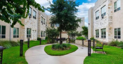 A landscaped courtyard with benches and greenery