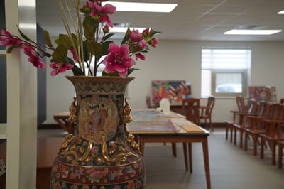 Interior common area with decorative vase and flowers