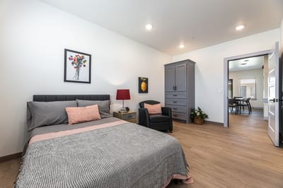Cozy resident room with bed and seating area