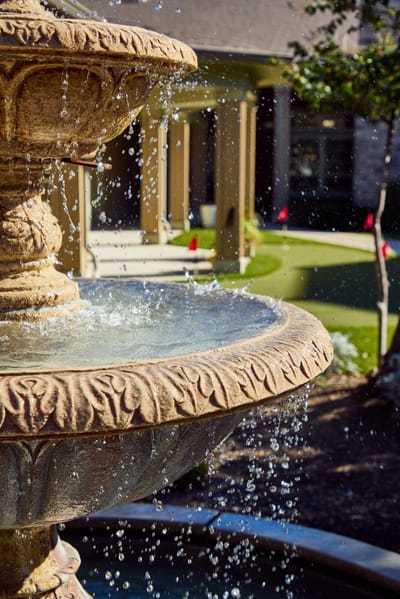 Decorative outdoor fountain with water cascading