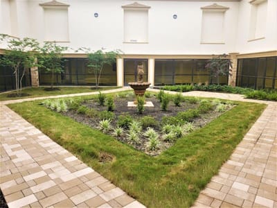 A serene courtyard garden with a fountain