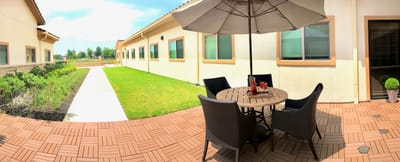 Outdoor patio with seating area near the building