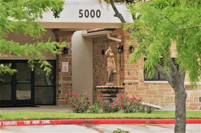 Exterior view of the facility entrance with landscaping