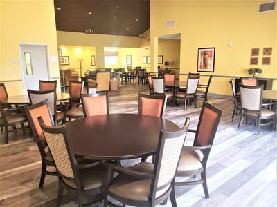 Common area with tables and chairs for socializing