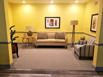 Bright common area with seating and decor