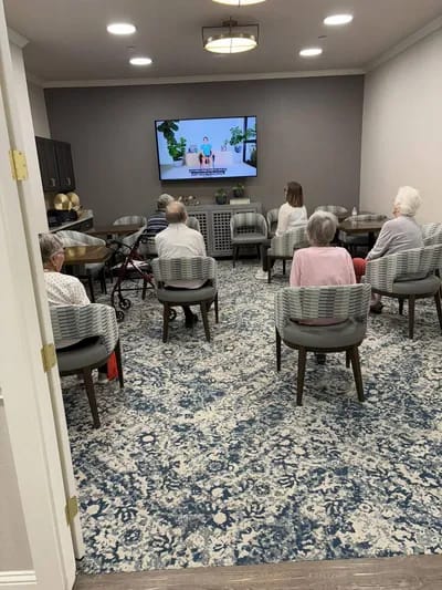 Residents watching a program in a common area
