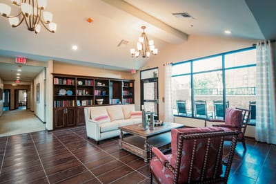 Bright common area with seating and bookshelves