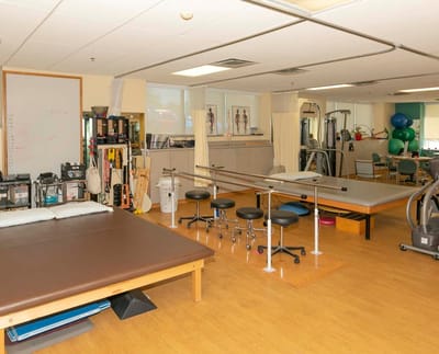 Physical therapy room with exercise equipment