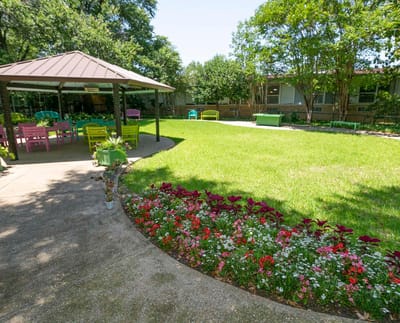 Garden area with seating and colorful flowers