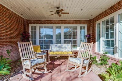 Outdoor seating area with rocking chairs