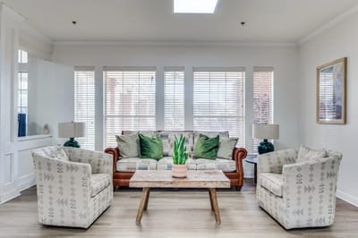 Bright common area with seating and natural light