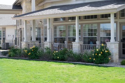 Exterior view of a facility's porch and garden