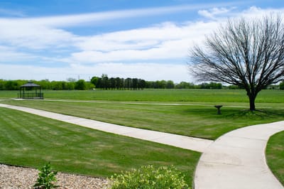Well-maintained outdoor space with walking paths and gazebo
