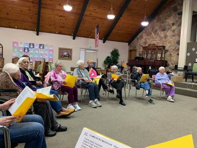 Residents participating in a group activity in a common area
