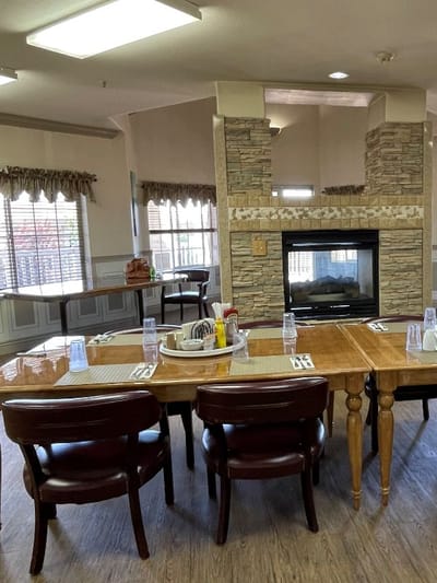 Dining area with a fireplace and table settings