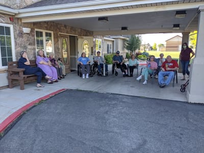 Residents enjoying time outside the facility