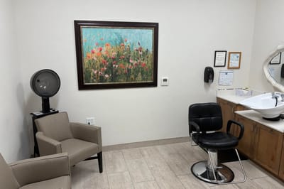 Interior view of a salon area with a painting