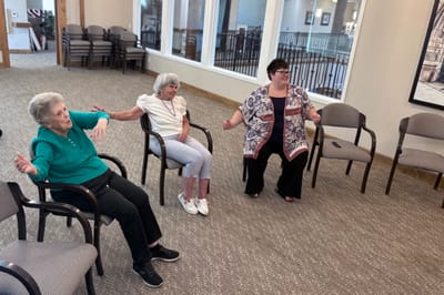 Residents engaging in a seated activity session