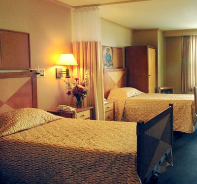 A cozy shared bedroom in a senior care facility
