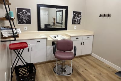 Interior view of a hair salon with styling chair