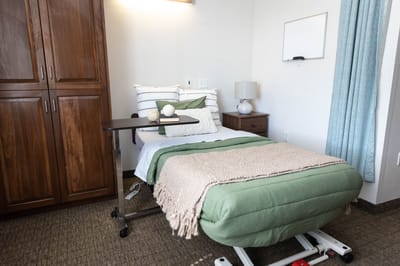 A private resident room with a bed and furniture