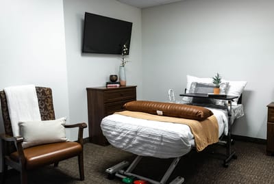 Cozy resident room with a bed and television
