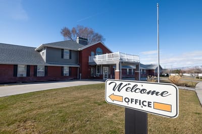 Exterior view of Lake Ridge Senior Living building with sign