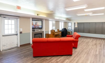 Interior view of a common area with seating and a piano
