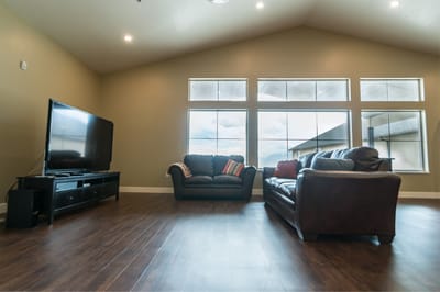 Interior of a common area with sofas and a TV