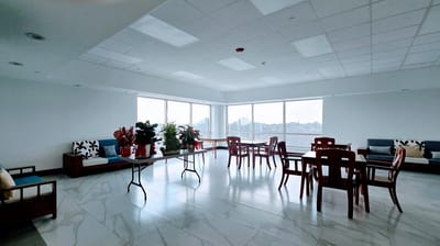 Bright, spacious common area with large windows and seating