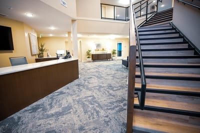 Interior view of a reception area with staircase