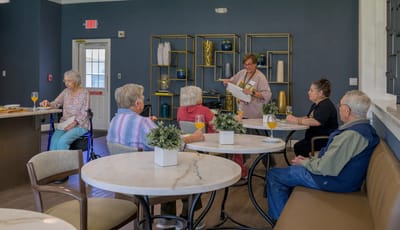 Residents and staff engaging in an activity in a common area