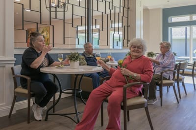 Residents enjoying drinks in a common area