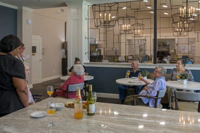 Residents enjoying a social gathering in a common area