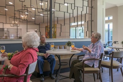 Residents enjoying refreshments in a common area