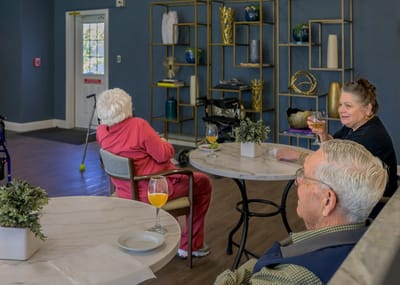 Residents enjoying drinks in a common area