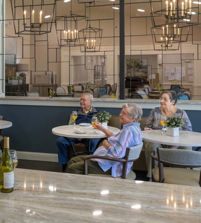 Residents enjoying drinks in a common area
