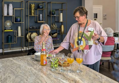 Residents enjoying refreshments in a common area